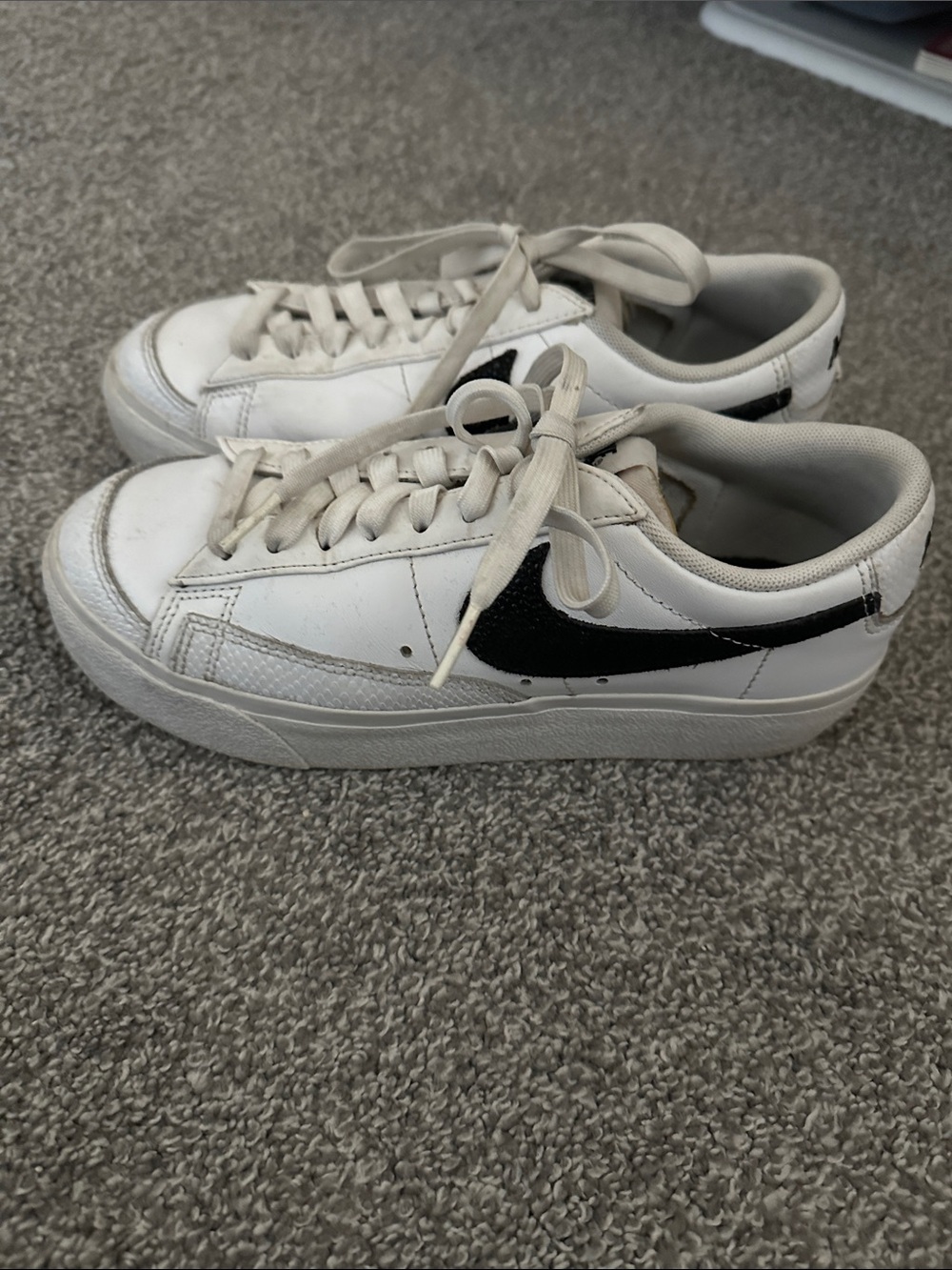 Nike White Sneakers with Black Swoosh